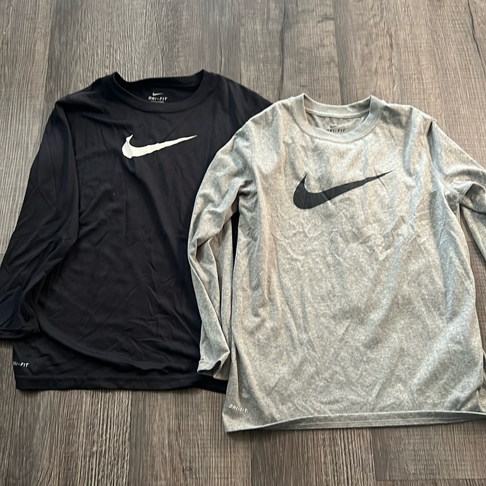 Two Nike boys dri fit long sleeve shirts.